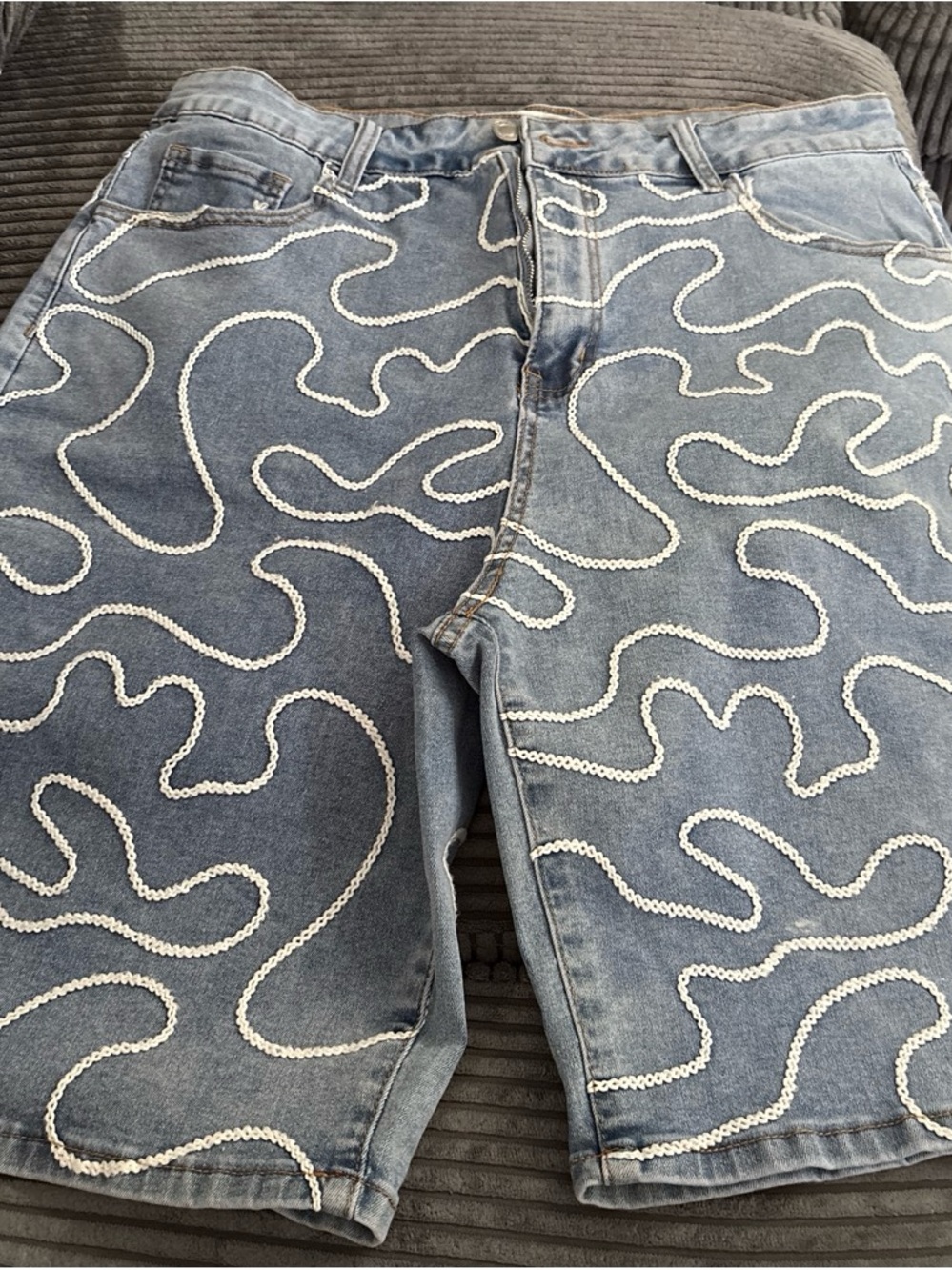 Relaxed Light Blue Denim Shorts with White Swirl Stitching